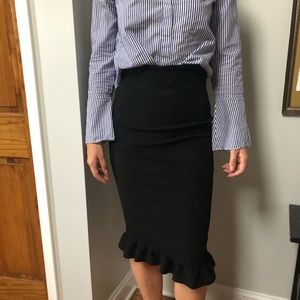 RIBBED FORM FITTING BLACK SKIRT WITH RUFFLES